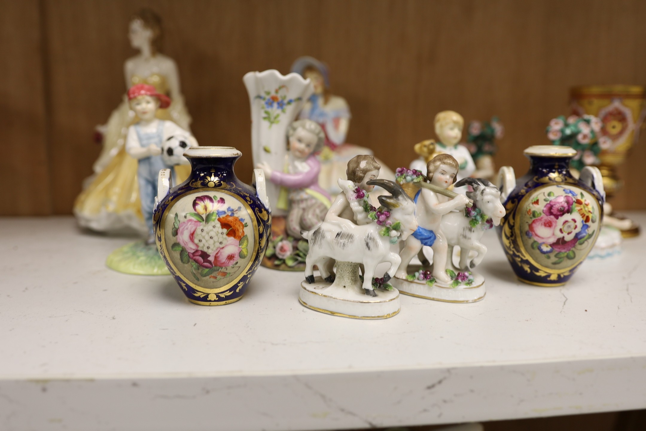 A selection of various miniature ceramics and figurines, to include Royal Crown Derby two handled vases with central panelled section display of flower, together with Royal Doulton figures, tallest 19cm